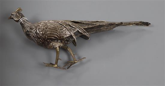 A 20th century Spanish white metal model of a pheasant (a.f.), length 28.5cm.